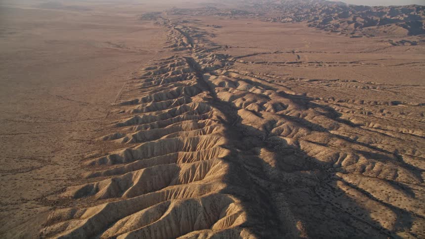 A mountain range stretches across a desert area
