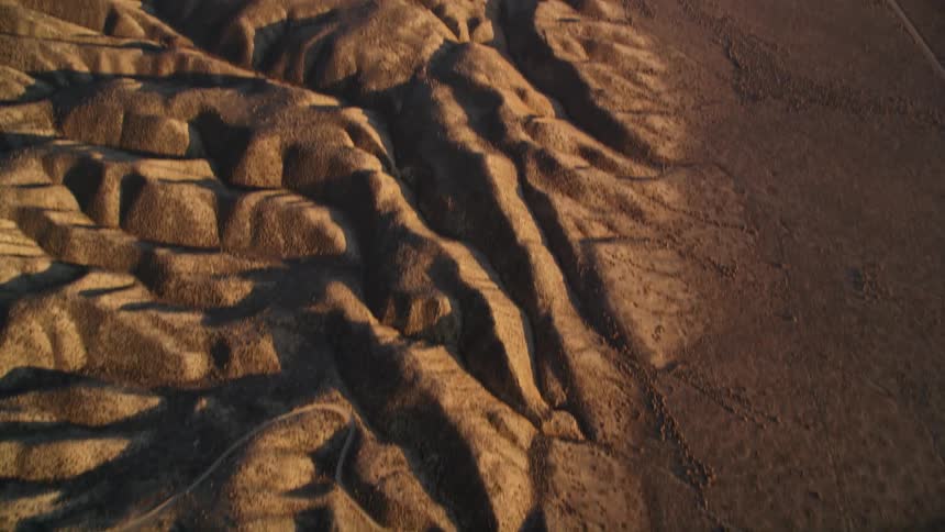 Aerial panorama of a paved road running through hills and mountains in a natural environment