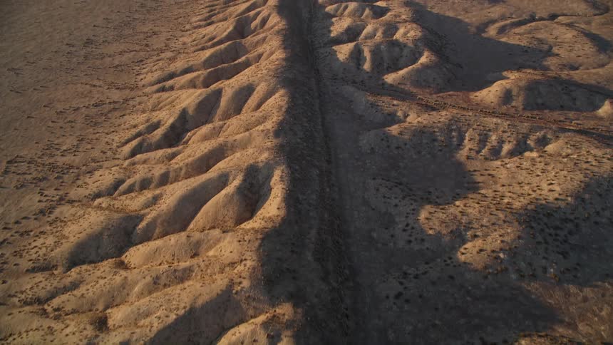 Aerial of mountain formations in the middle of the desert
