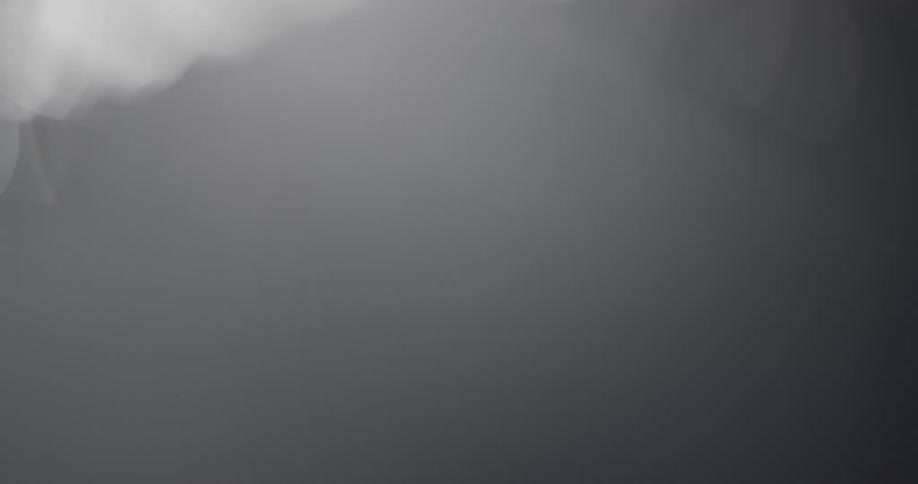 Several blurred beams of lights on a black background