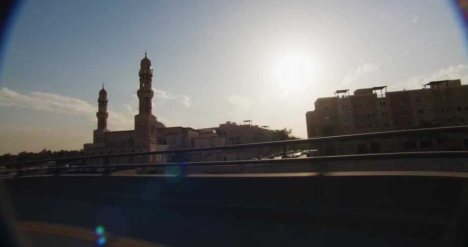 A clip footage of a city taken from a moving car