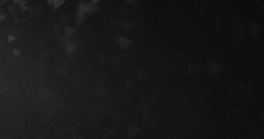Figures of abstract triangles in motion on a black background