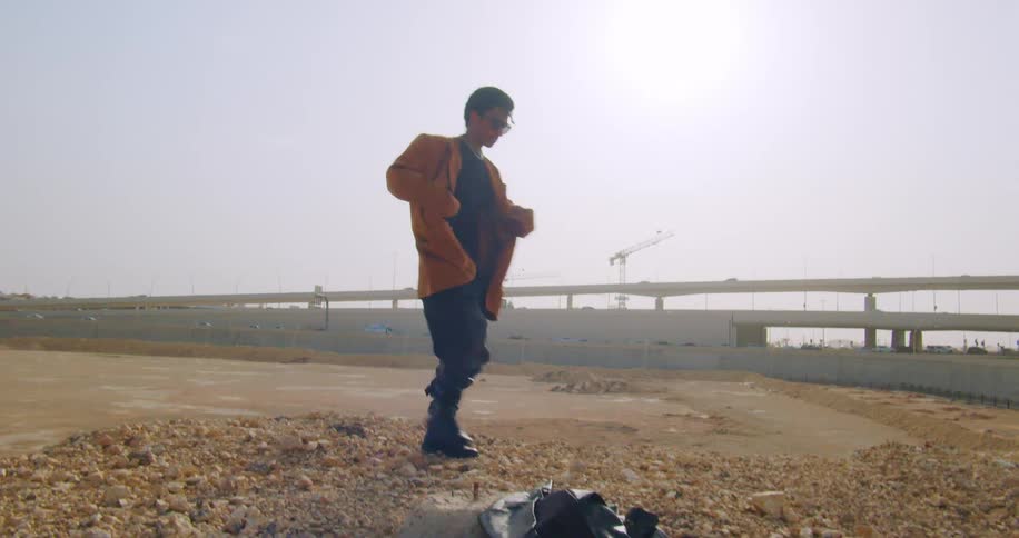 A man walks by the overpass