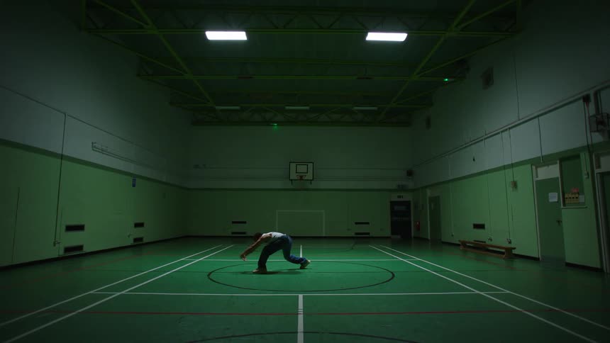 Person dancing on a basketball court