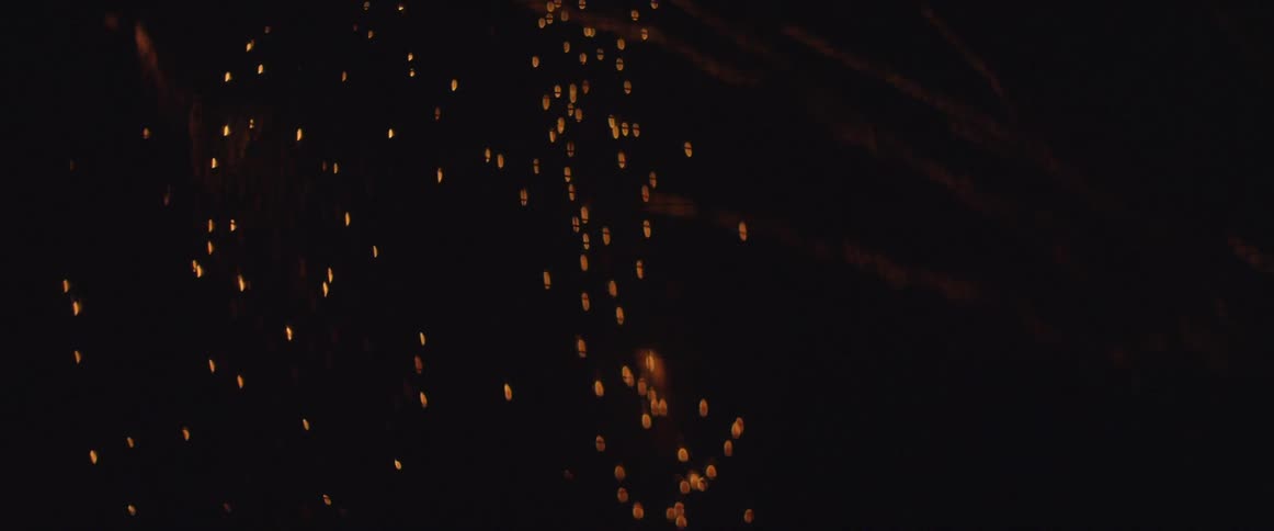 Sparks flying in a dark area