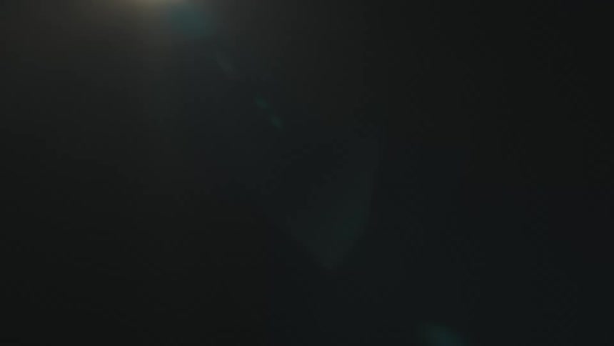 A dim soft light shines softly against a dark background