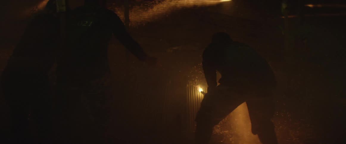People shoot fireworks at night