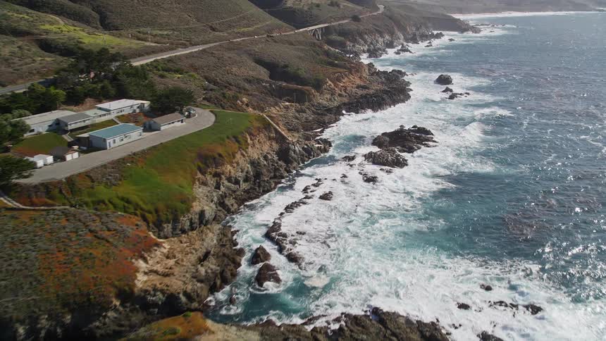 Aerial landscape of rocky coast with highway and seaside