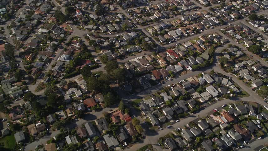 Aerial panoramic view of an urban city with intersections through residential neighborhoods