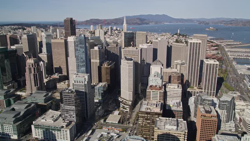 San francisco skyline in the distance with the oakland bay bridge in the foreground