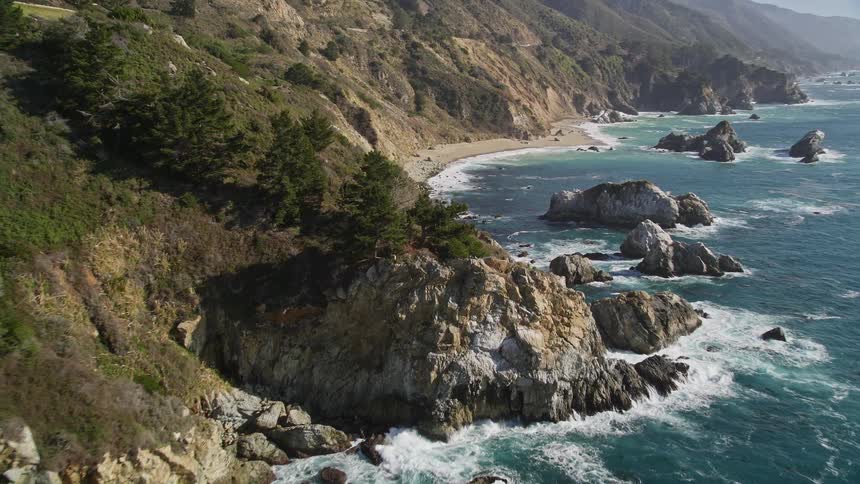 Aerial landscape of rocky mountains by the sea