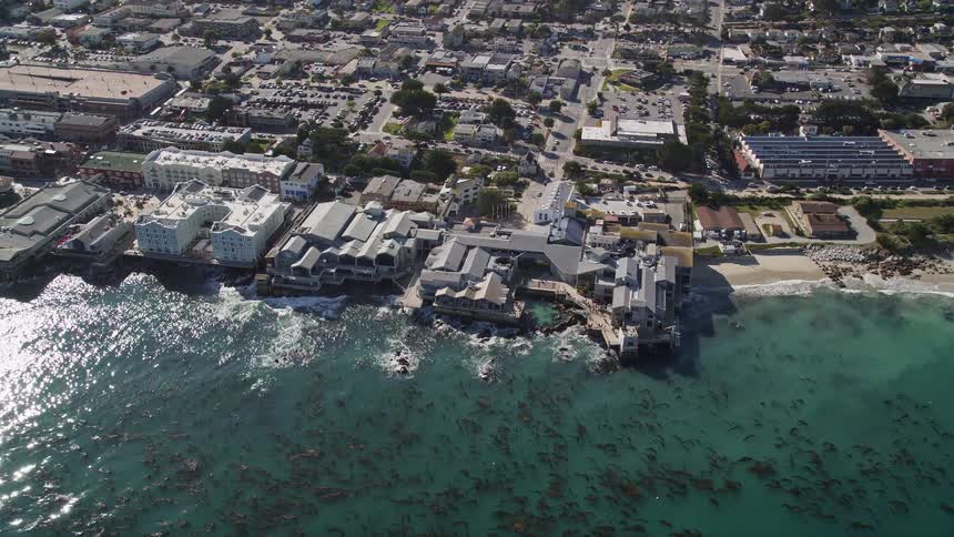 Aerial scenery of an urban city with buildings and houses on the edge of the sea