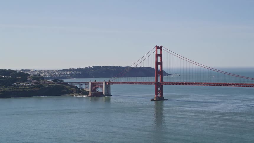 Landscape of the red golden gate bridge over the sea and connecting mountains and peninsulas