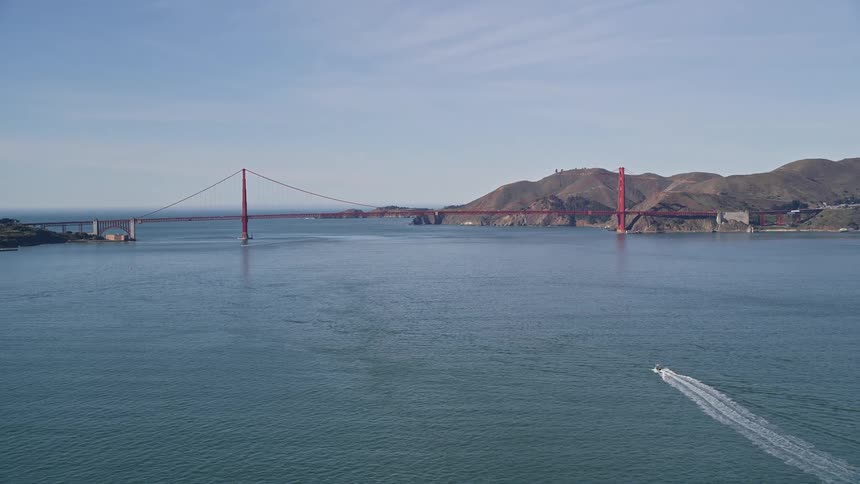 Aerial panorama of the golden gate bridge connecting mountains and the sea