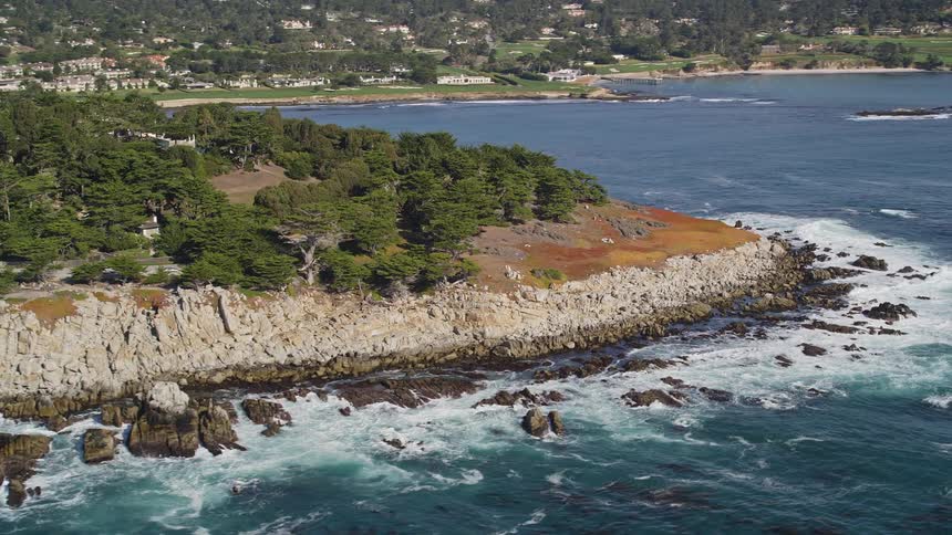 Urban city on a peninsula with vegetation and by the sea