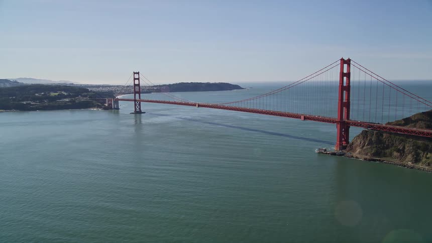 Aerial landscape of the golden gate bridge over a vast blue sea