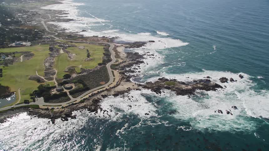 Aerial panorama of an urban city on a seaside peninsula seen during the day