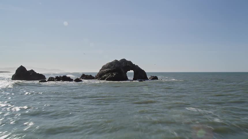 Panorama of an extensive peninsula with rocks at sea
