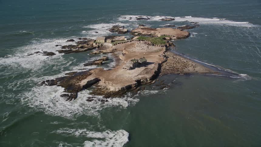 Aerial panorama of an isolated island with some houses