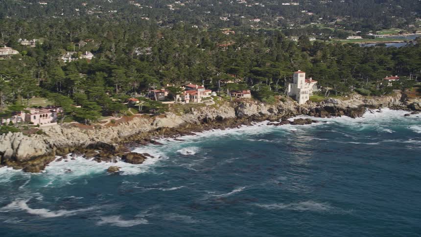 Aerial panorama of a city built on a wooded peninsula by the sea