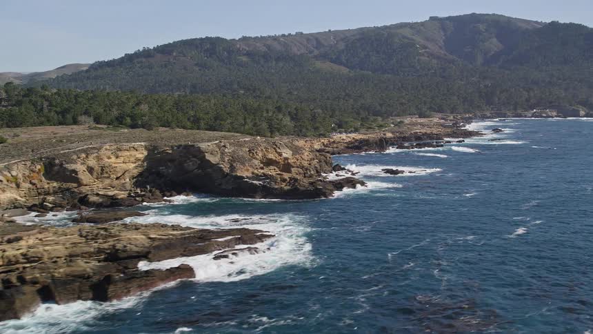 Landscape of wooded mountains by the sea