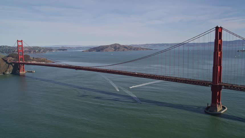 Aerial panorama of the golden state bridge across a vast ocean