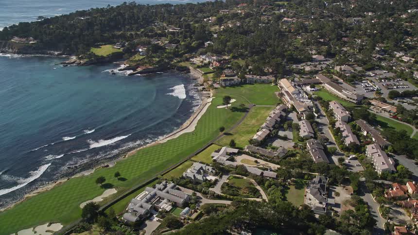 Aerial panorama of houses and resorts on a seaside peninsula