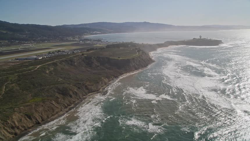 Aerial view of a coastal area with urban areas and the edge of a beach