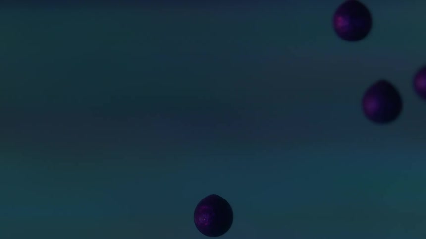 Purple droplets falling in front of a screen