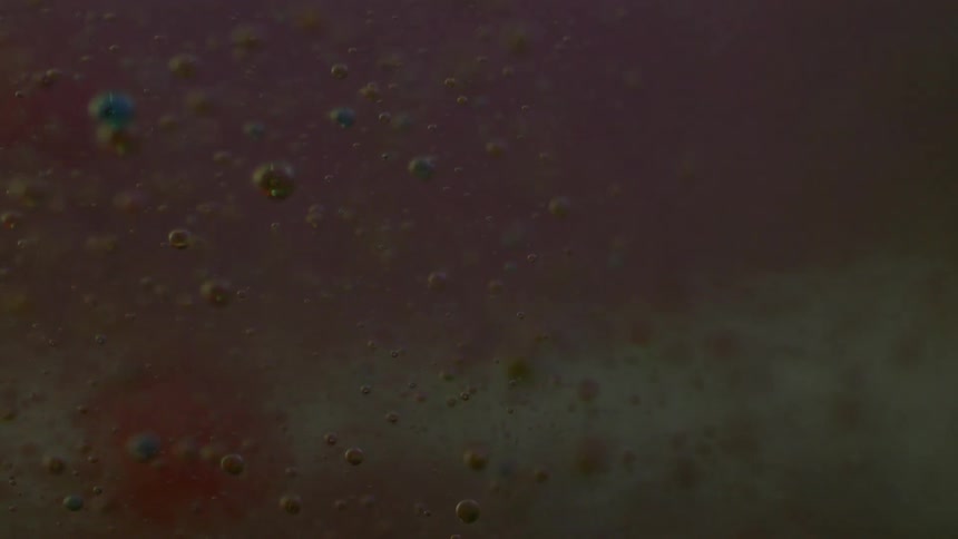 Bubbles are slowly rising in a liquid suspension