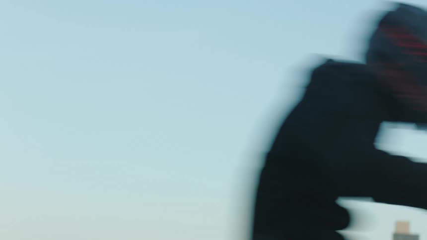 A person rides by on the motorcycle on the freeway