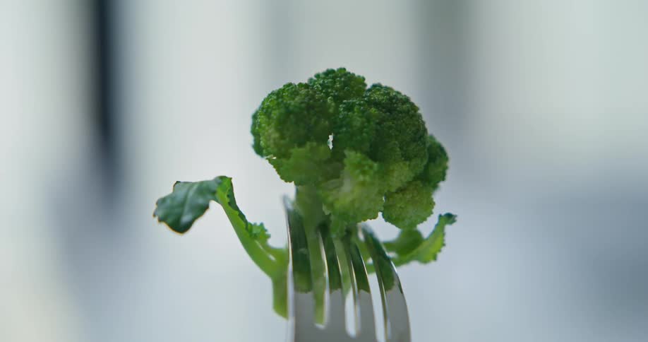 Close up of broccoli on the end of a fork