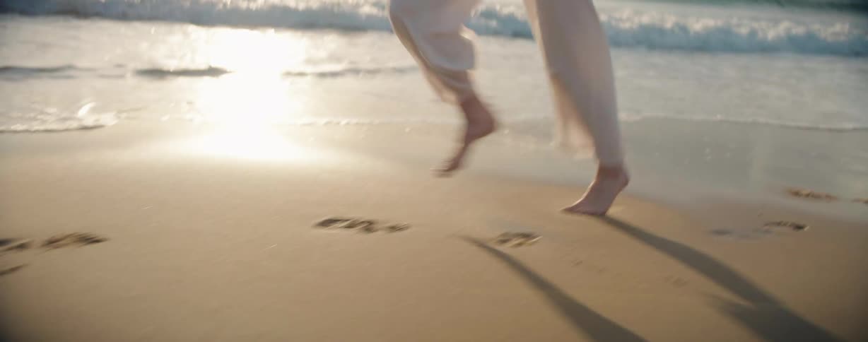 A clip of a person running on the beach