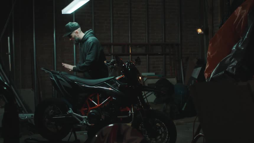 A man is working on a bike in the shop