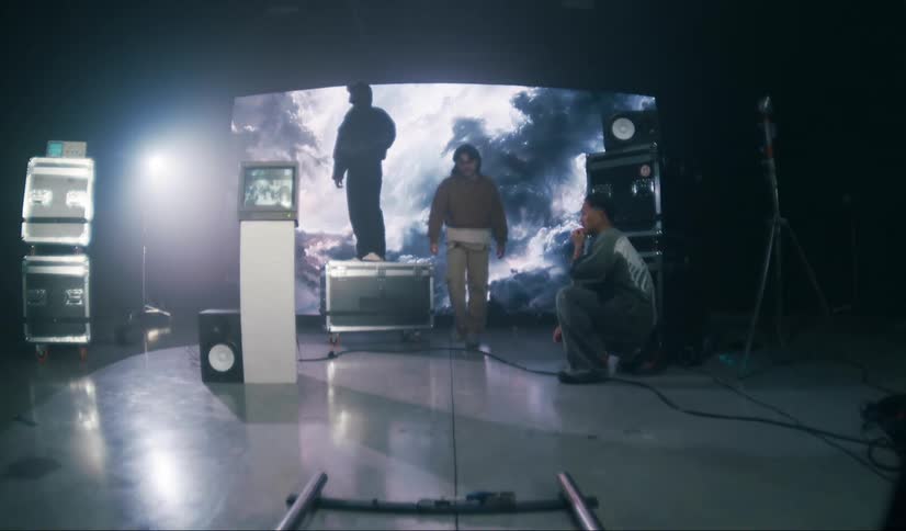 Men are setting up in the studio