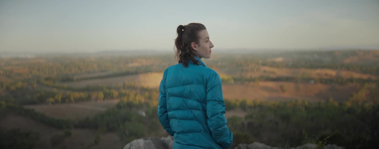 A woman is looking out over the landscape