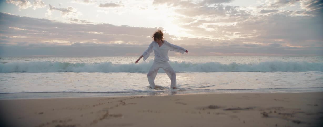 A clip of a dancer on the beach