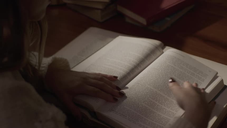 Woman sitting reading a book