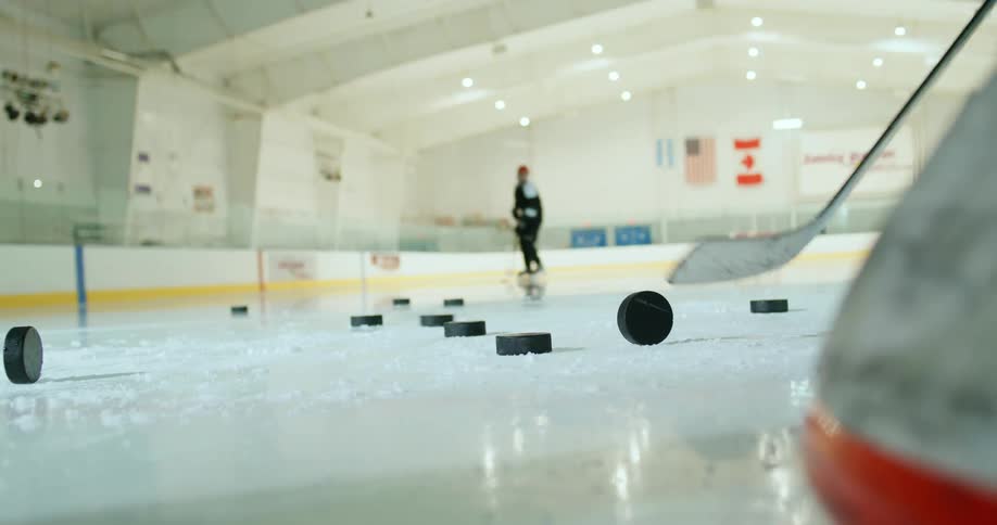 Hockey players on an ice rink practicing