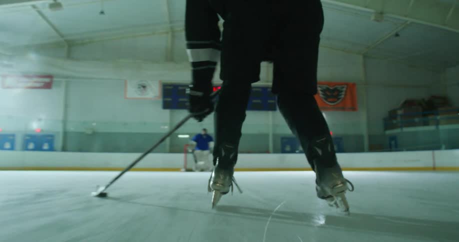 Person scoring a goal in training on a hockey court