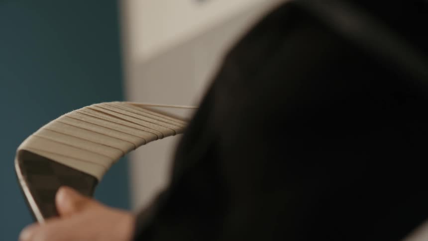 A player is taping up their hockey stick