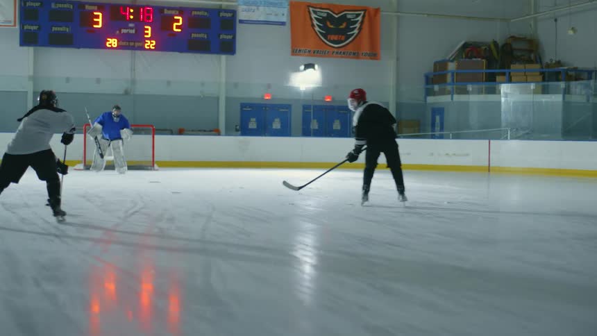 Hockey players compete on the ice