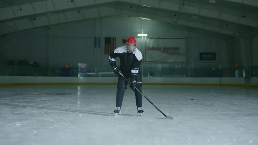 Player running into position on a hockey court
