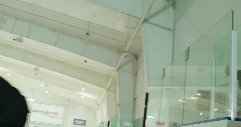 Players enter the hockey rink one by one