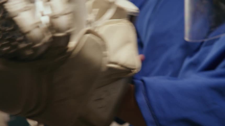 Person putting on hockey glove