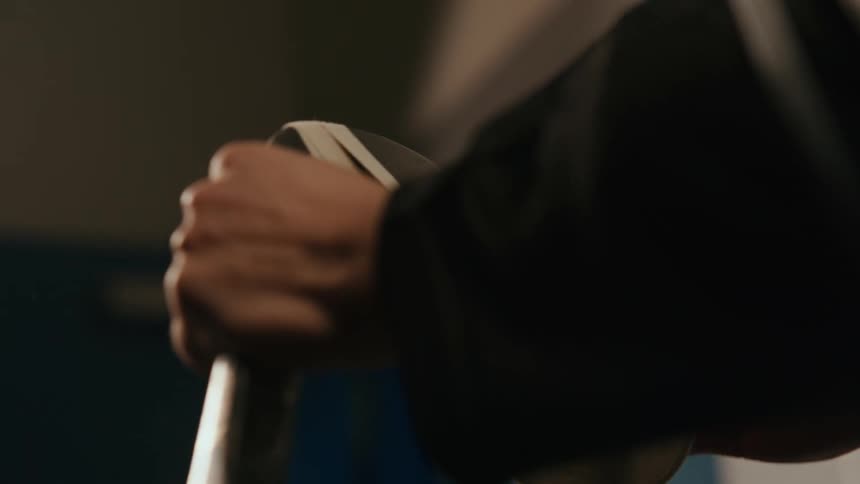 Person taping his hockey equipment