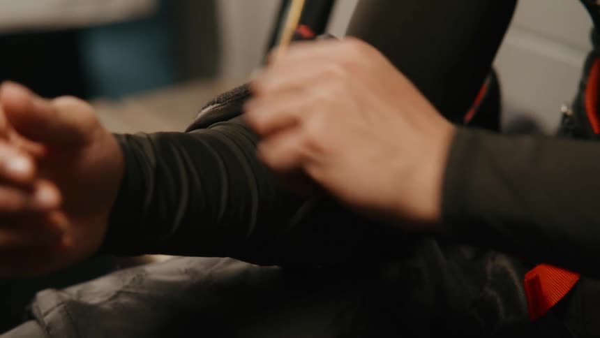 Person putting an elbow pad on their arm