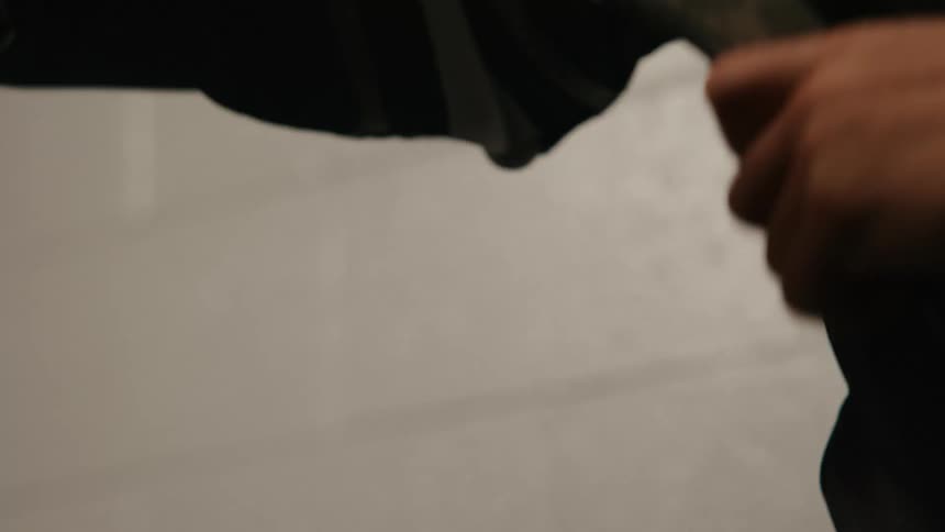 A close up clip of a person taping a hockey stick