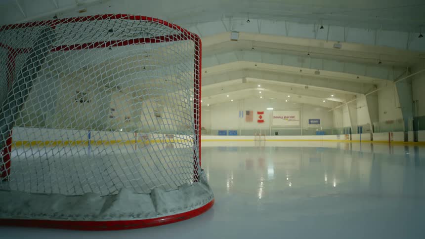 A clip of a hockey rink with lights turning off