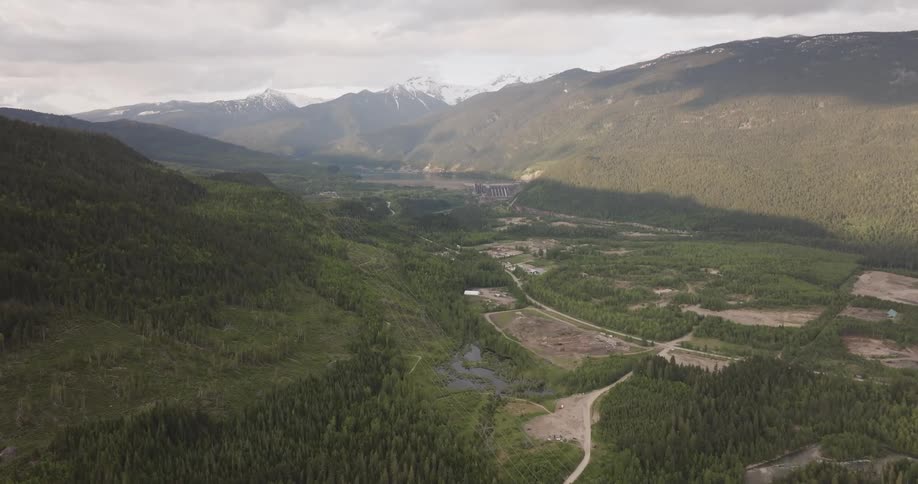Large mountain valley looking at hydro dam in the distance